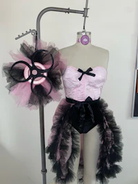 a pink and black tutu on a mannequin