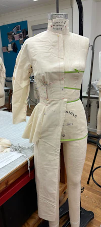 a mannequin in a sewing room